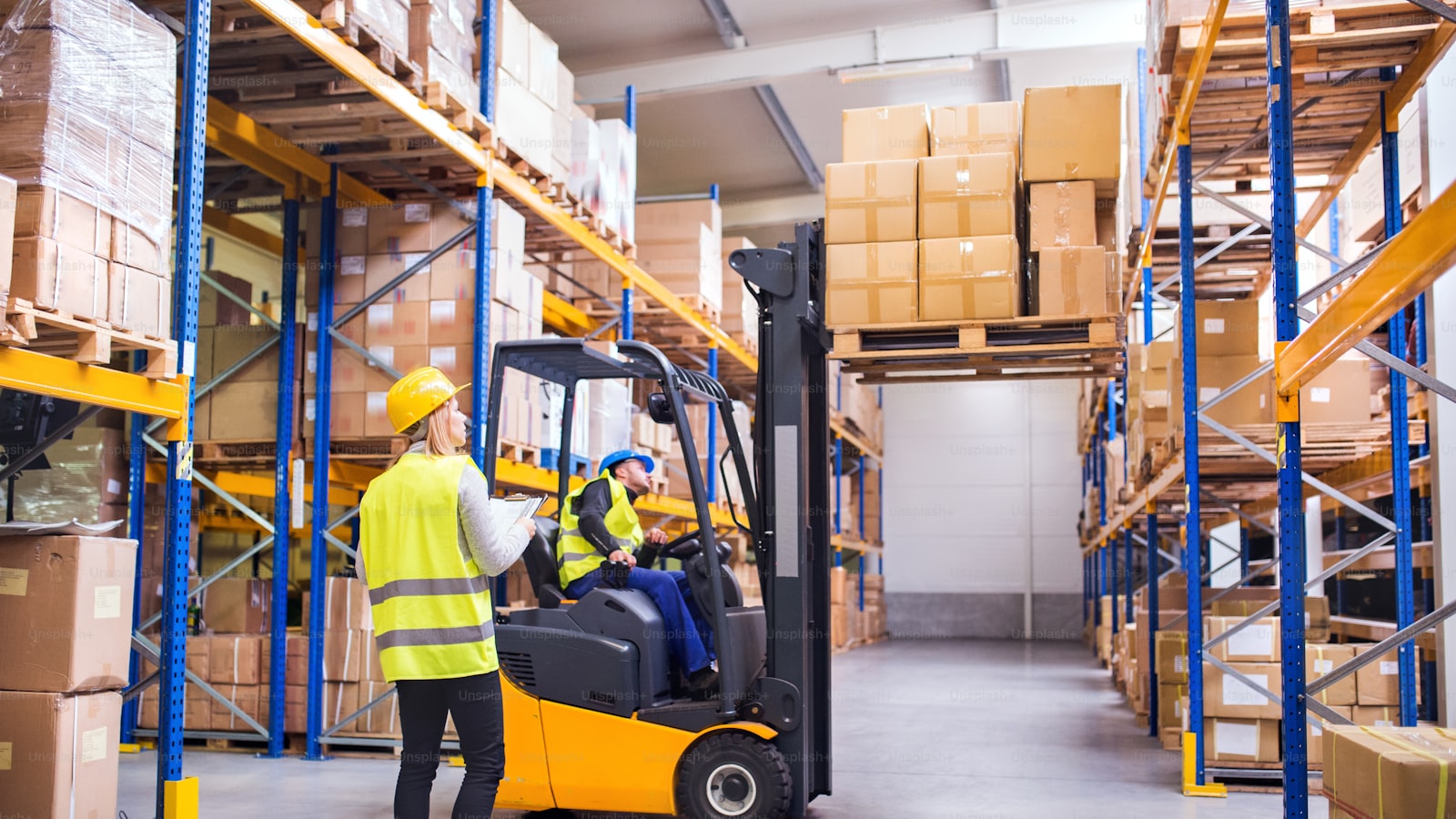 Manufacturing workers collaborating in a modern warehouse facility